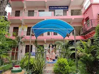 Shrine building with deity mural at Bharat Sevashram Sangha Prayagraj
