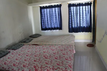 Guest room interior at Bharat Sevashram Sangha Prayagraj